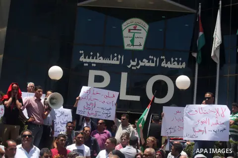Palestinians demonstrating in front of the Palestine Liberation Organization (PLO) offices in the West Bank city of Ramallah, on July 15, 2013, as they protest against secret meetings between officials from the PLO and I...