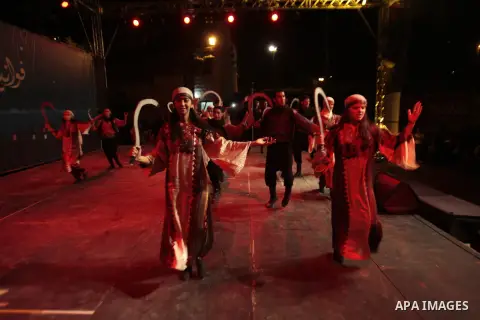 Palestinians youth participate in dancing of "Dabka" heritage during "fawanees Ramadan" during the fasting month of Ramadan in the West Bank of Nablus city on July 24, 2013. Photo by Nedal Eshtayah