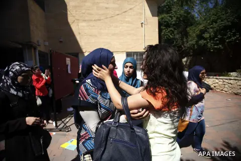 Palestinian students celebrated after hearing the results of their final exams known as "Tawjihi" in Jerusalem, on July 25, 2013. The Ministry of Education in Gaza Strip and the West Bank announced the results together....