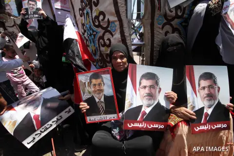 Members of the Muslim Brotherhood and supporters of ousted Egyptian President Mohamed Mursi take part in a rally around Rabaa Adawiya square where they are camping, in Cairo July 26, 2013. Mursi is under investigation fo...