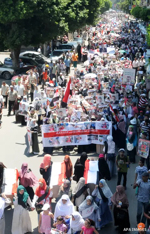 Egyptians supporting ousted president Mohamed Morsi attend a protest near Cairo University in Giza, Egypt, 30 July 2013. Egyptian authorities on 26 July ordered ousted president Mohammed Morsi to be detained for 15 days...