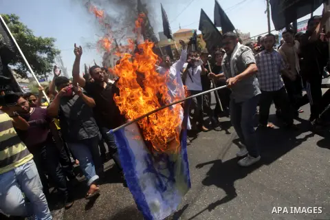 Palestinians take part in a protest as they mark Quds Day or Jerusalem Day in Gaza city, Friday, Aug. 02, 2013. The late Iranian leader Ayatollah Khomeni declared the last Friday of the Islamic fasting month of Ramadan a...