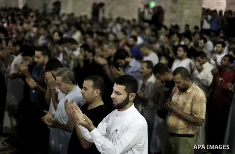 Palestinians pray during Laylat Al Qadr prayers on the 27th day of the holy fasting month of Ramadan at Al Emari mosque in Gaza City early on August 5, 2013. Muslims fasting in the month of Ramadan must abstain from food...