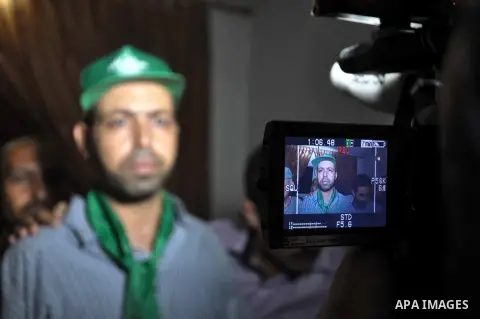A freed Palestinian prisoner, Samir Mortaga is welcomed upon his arrival near the Erez crossing, between Israel and Gaza in the Northern Gaza Strip. Israel released 26 long-held Palestinian prisoners in a planned goodwil...