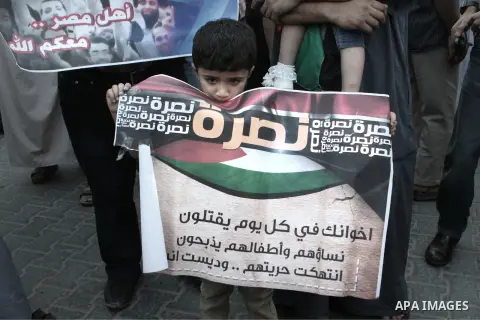 Palestinian supporters of the radical Islamist movement Hamas shout slogans during a protest calling to expel the delegation of Fatah movement from Gaza Strip, and in support of Egypt's deposed president Mohamed Morsi, i...