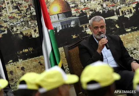 Palestinian Prime Minister in Gaza strip, Ismail Haniyeh, honors the prisoners released, in Gaza city on Aug. 19, 2013. Israel released 26 long-held Palestinian prisoners in a planned goodwill gesture hours ahead of a sc...