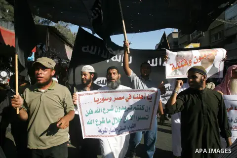 Palestinian Salafists shout slogans during a rally in protest of what they say are recent massacres committed against Syrian and Egyptian people and against Syria's President Bashar al-Assad and Egypt's army chief Genera...