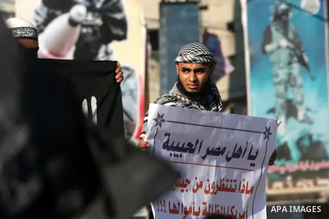 Palestinian Salafists shout slogans during a rally in protest of what they say are recent massacres committed against Syrian and Egyptian people and against Syria's President Bashar al-Assad and Egypt's army chief Genera...