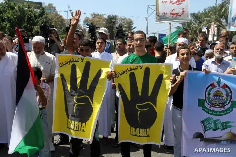 Palestinian supporters of Hamas and Islamic Jehad take part in a protest against Palestinian-Israeli negotiations, and supporting Egypt's ousted President Mohammed Morsi on August 23, 2013, in Gaza City. A senior Palesti...