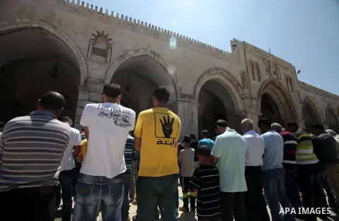 Palestinian worshipers attend the Friday prayers at al-Aqsa mosque compund in Jerusalem's Old City, Aug 23, 2013. Photo by Saeed Qaq