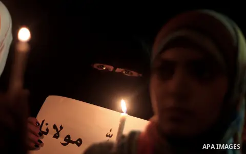 Palestinian women hold lit candles during a protest against Syria's President Bashar al-Assad in front of the U.N. headquarters in Gaza City August 23, 2013. U.N. Secretary-General Ban Ki-moon said on Friday he intends t...