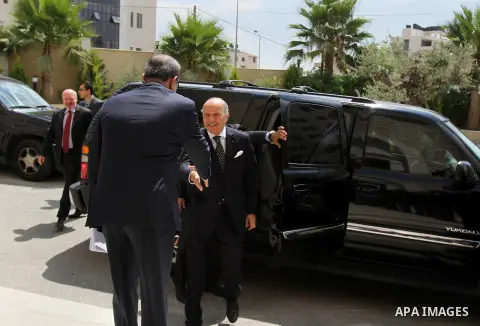 French Foreign Minister Laurent Fabius (R) is welcomed as he arrives for a meeting with Palestinian Prime Minister on August 24, 2013 in the West Bank city of Ramallah. Fabius visits Israel and the Palestinian territorie...
