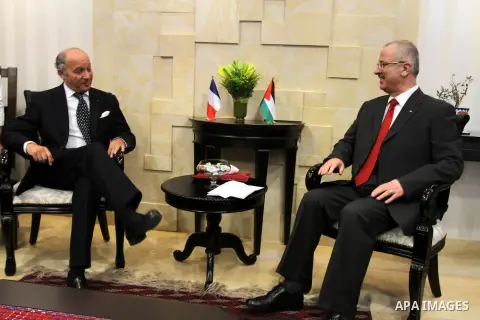 French Foreign Minister Laurent Fabius meets with Palestinian Prime Minister Rami Hamdallah (R) on August 24, 2013 in the West Bank city of Ramallah. Fabius visits Israel and the Palestinian territories this weekend to e...