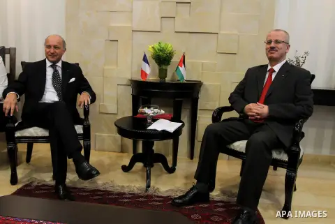 French Foreign Minister Laurent Fabius meets with Palestinian Prime Minister Rami Hamdallah (R) on August 24, 2013 in the West Bank city of Ramallah. Fabius visits Israel and the Palestinian territories this weekend to e...