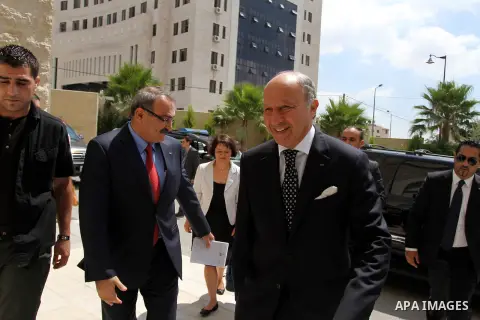 French Foreign Minister Laurent Fabius (R) is welcomed as he arrives for a meeting with Palestinian Prime Minister on August 24, 2013 in the West Bank city of Ramallah. Fabius visits Israel and the Palestinian territorie...