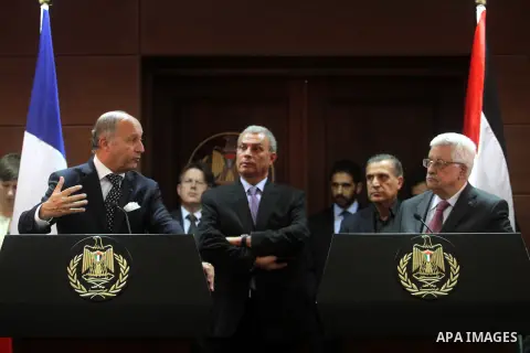 French Foreign Minister Laurent Fabius and Palestinian President Mahmoud Abbas (R) give a joint press conference after a meeting on August 24, 2013 in the West Bank city of Ramallah. Fabius visits Israel and the Palestin...