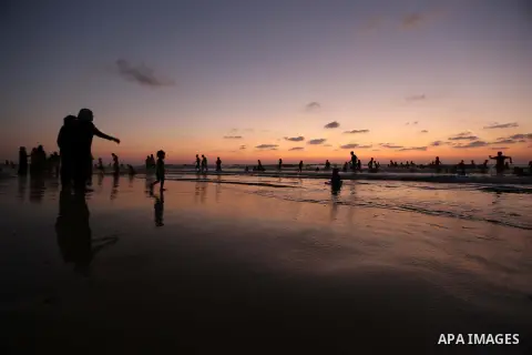 Palestinians enjoy swimming in the sea at Gaza beach during Friday holiday in Gaza city, Aug. 23, 2013. Gazans escape to the beach and out from their homes during heat wave and power outages. Photo by Mahmoud Hamda