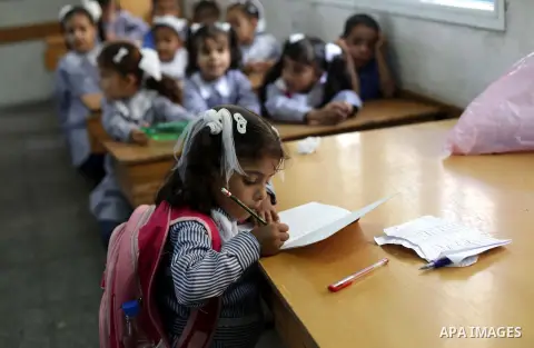 Palestinian school children attend a class at a U.N.-run school in Dir al-Balah in the central Gaza Strip, on the first day of the school year August 25, 2013. Photo by Ashraf Amra