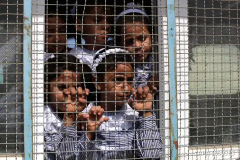 Palestinian school children attend a class at a U.N.-run school in Dir al-Balah in the central Gaza Strip, on the first day of the school year August 25, 2013. Photo by Ashraf Amra