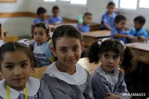 Palestinian school children attend a class at a U.N.-run school in Dir al-Balah in the central Gaza Strip, on the first day of the school year August 25, 2013. Photo by Ashraf Amra