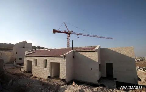 A picture shows the construction site in Pisgat Zeev, an urban settlement in an area Israel annexed to Jerusalem after capturing it in the 1967 Middle East war, near the Arab village of Beit Hanina, August 25, 2013. Pale...