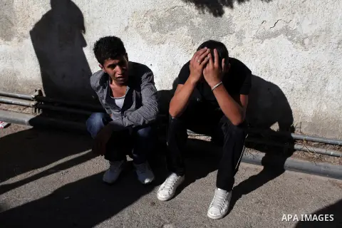 Relatives mourn the deaths of two Palestinians shot dead by Israeli troops, at a hospital in the West Bank city of Ramallah August 26, 2013. Israeli troops on Monday shot dead two Palestinians and wounded more than a doz...