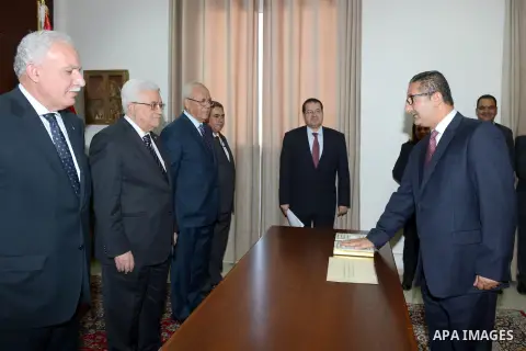 Palestinian President Mahmoud Abbas swears in Issa Qessisi as new Ambassador to the Vatican, in the West Bank City of Ramallah August 26, 2013. Photo by Thaer Ganaim