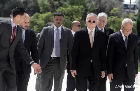 Secretary-General of the Organisation of Islamic Cooperation Ekmeleddin Ihsanoglu arrives to the West Bank City of Ramallah, Aug 27, 2013. Ihsanoglu in two days visit to Ramallah to discuss the latest developments in Pal...
