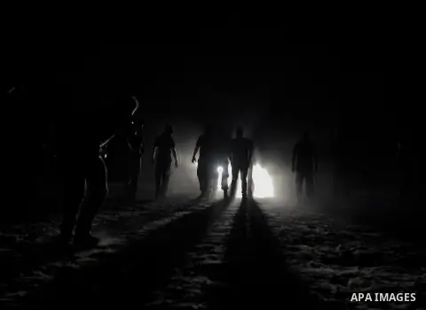 Palestinian militants of al-Nasser Salah al-Din Brigades, the armed wing of the Popular Resistance Committees (PRC), take part in a night military-style exercises at a training camp in Rafah in the southern Gaza Strip, A...