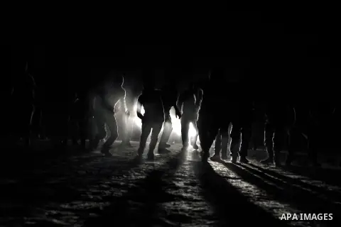 Palestinian militants of al-Nasser Salah al-Din Brigades, the armed wing of the Popular Resistance Committees (PRC), take part in a night military-style exercises at a training camp in Rafah in the southern Gaza Strip, A...