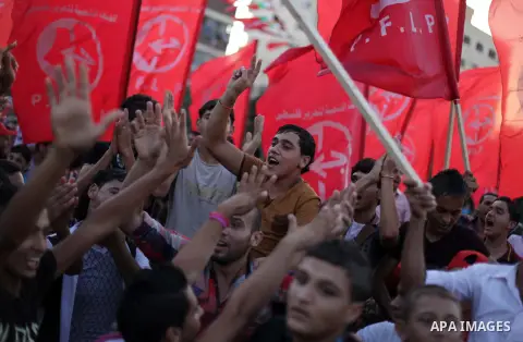 Palestinian supporters of Popular Front for the Liberation of Palestine (PFLP) take part in a rally marking the 12th anniversary of the killing of Abu Ali Mustafa, leader of (PLFP), in Gaza City August 27, 2013. Abu Must...