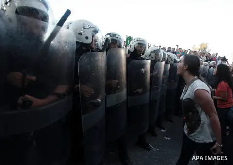 Palestinian riot police clash with protesters demonstrating against the Palestinian-Israeli negotiations as they try to march towards headquarters of Palestinian president Mahmud Abbas, in the West Bank city of Ramallah...