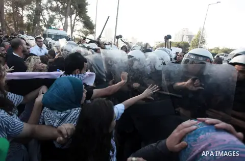 Palestinian riot police clash with protesters demonstrating against the Palestinian-Israeli negotiations as they try to march towards headquarters of Palestinian president Mahmud Abbas, in the West Bank city of Ramallah...