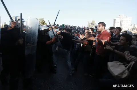 Palestinian riot police clash with protesters demonstrating against the Palestinian-Israeli negotiations as they try to march towards headquarters of Palestinian president Mahmud Abbas, in the West Bank city of Ramallah...