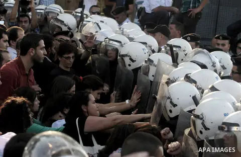 Palestinian riot police clash with protesters demonstrating against the Palestinian-Israeli negotiations as they try to march towards headquarters of Palestinian president Mahmud Abbas, in the West Bank city of Ramallah...