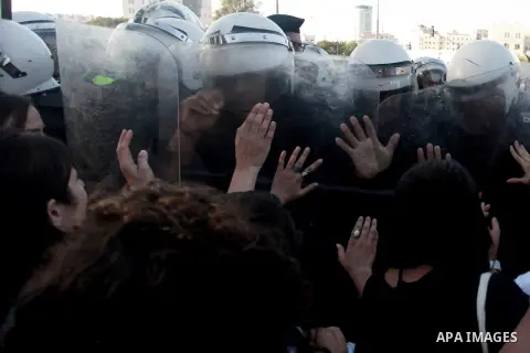 Palestinian riot police clash with protesters demonstrating against the Palestinian-Israeli negotiations as they try to march towards headquarters of Palestinian president Mahmud Abbas, in the West Bank city of Ramallah...