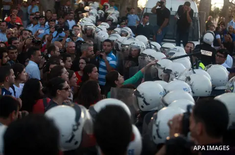 Palestinian riot police clash with protesters demonstrating against the Palestinian-Israeli negotiations as they try to march towards headquarters of Palestinian president Mahmud Abbas, in the West Bank city of Ramallah...