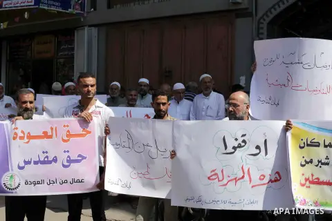 Palestinians take part a protest during a demonstration against the Palestinian-Israeli negotiations as they try to march towards headquarters of Palestinian president Mahmud Abbas, in the Gaza on Aug. 29, 2013. Israeli...