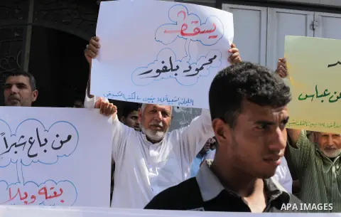 Palestinians take part a protest during a demonstration against the Palestinian-Israeli negotiations as they try to march towards headquarters of Palestinian president Mahmud Abbas, in the Gaza on Aug. 29, 2013. Israeli...