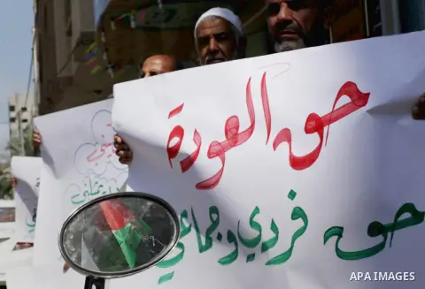 Palestinians take part a protest during a demonstration against the Palestinian-Israeli negotiations as they try to march towards headquarters of Palestinian president Mahmud Abbas, in the Gaza on Aug. 29, 2013. Israeli...