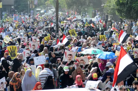 Supporters of the Muslim Brotherhood and Egypt's toppled president Mohamed Morsi demonstrate in Cairo on August 30, 2013. Several thousand Egyptians protested in Cairo in support of ousted president Mohamed Morsi, their...
