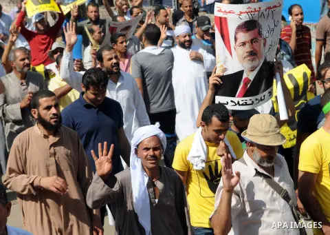 Supporters of the Muslim Brotherhood and Egypt's toppled president Mohamed Morsi demonstrate in Cairo on August 30, 2013. Several thousand Egyptians protested in Cairo in support of ousted president Mohamed Morsi, their...