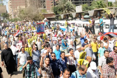 Supporters of the Muslim Brotherhood and Egypt's toppled president Mohamed Morsi demonstrate in Cairo on August 30, 2013. Several thousand Egyptians protested in Cairo in support of ousted president Mohamed Morsi, their...