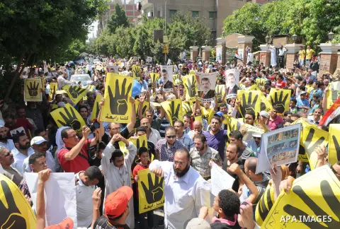 Supporters of the Muslim Brotherhood and Egypt's toppled president Mohamed Morsi demonstrate in Cairo on August 30, 2013. Several thousand Egyptians protested in Cairo in support of ousted president Mohamed Morsi, their...