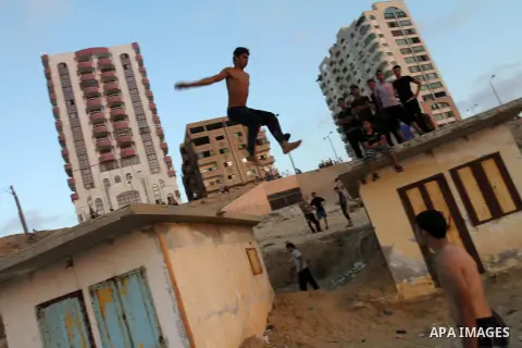 Palestinians play at the beach of Gaza City during the weekend western Gaza City on Aug 30, 2013. Photo by Mohammed Asad