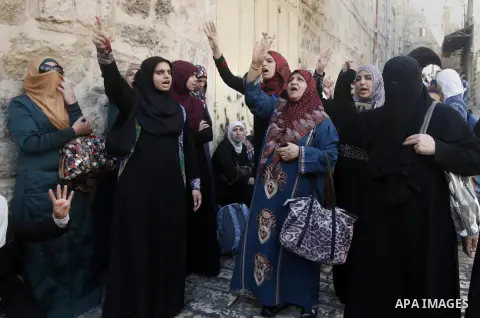 Palestinian women protest in Jerusalem's Old City, as minor clashes take place at a nearby compound known to Muslims as Noble Sanctuary and to Jews as Temple Mount September 4, 2013. An Israeli police spokesperson said f...