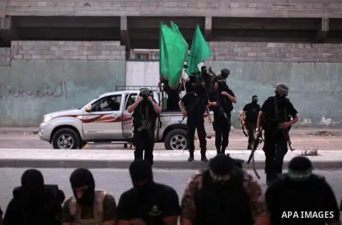 Militants of the Hamas's armed wing, Ezzeddine al-Qassam Brigades, hold a military parade in Gaza City on Septemper 4, 2013. Photo by Ashraf Amra