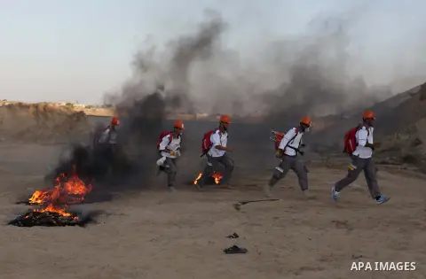 During a drill, Palestinian medics attend to a 'victim' of an explosion as part of an exercise of a graduation ceremony of medics, in Mughraqa, central Gaza Strip, Thursday, Sept. 5, 2013. Medics from the Palestine Red C...
