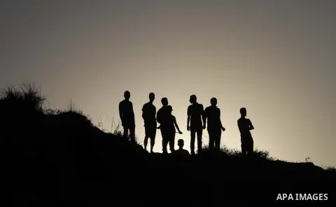 Palestiniains watch a drill during a graduation ceremony of medics, in Mughraqa, central Gaza Strip, Thursday, Sept. 5, 2013. Medics from the Palestine Red Crescent Society and volunteers at the National Disaster Respons...