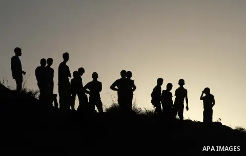 Palestiniains watch a drill during a graduation ceremony of medics, in Mughraqa, central Gaza Strip, Thursday, Sept. 5, 2013. Medics from the Palestine Red Crescent Society and volunteers at the National Disaster Respons...